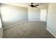 A spacious bedroom boasts light gray walls, plush carpeting, and ample natural light at 2906 Fieldwood Cir, St Cloud, FL 34772