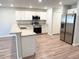 Bright kitchen featuring stainless steel appliances, modern white cabinets, and granite counters at 2906 Fieldwood Cir, St Cloud, FL 34772