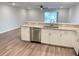 Kitchen with breakfast bar featuring granite countertops and stainless steel appliances at 2906 Fieldwood Cir, St Cloud, FL 34772