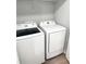 Laundry area with a white Samsung washing machine and dryer at 2906 Fieldwood Cir, St Cloud, FL 34772