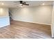 Open-concept living area with wood-look flooring and staircase to the second floor at 2906 Fieldwood Cir, St Cloud, FL 34772