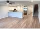 Open-concept living space with a kitchen, stainless steel appliances, and breakfast bar at 2906 Fieldwood Cir, St Cloud, FL 34772