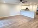 Living space with open kitchen, white cabinets, and stainless steel appliances at 2906 Fieldwood Cir, St Cloud, FL 34772