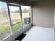 Enclosed porch with concrete flooring and a view of the fenced yard at 2906 Fieldwood Cir, St Cloud, FL 34772