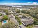 Aerial view of the residential area with the community pool visible, surrounded by mature trees and houses at 542 Cascade Cir # 102, Casselberry, FL 32707