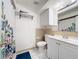Bathroom with a shower/tub, white cabinets, and a tropical shower curtain at 542 Cascade Cir # 102, Casselberry, FL 32707
