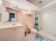 Bathroom featuring a vanity with sink, a shower with blue patterned shower curtain, and a toilet at 542 Cascade Cir # 102, Casselberry, FL 32707