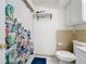 Bathroom with a shower/tub, white cabinets, and a tropical shower curtain at 542 Cascade Cir # 102, Casselberry, FL 32707