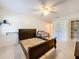 Unfurnished bedroom showcasing tile flooring, a ceiling fan, and a dark-colored bed frame at 542 Cascade Cir # 102, Casselberry, FL 32707