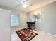 Small bedroom with tile floors, white walls, and a window to the outside at 542 Cascade Cir # 102, Casselberry, FL 32707