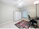 Small bedroom with tile floors, white walls, and a window to the outside at 542 Cascade Cir # 102, Casselberry, FL 32707