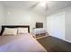 Comfortable bedroom with tile flooring, ceiling fan, dresser with TV, and a closet with sliding doors at 542 Cascade Cir # 102, Casselberry, FL 32707