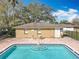 Stunning community pool with ample seating, trees, and fencing for added privacy at 542 Cascade Cir # 102, Casselberry, FL 32707