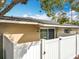 Exterior view of the property, showcasing a private patio, fence, and outdoor lighting at 542 Cascade Cir # 102, Casselberry, FL 32707