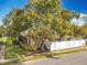 The property boasts a mature tree canopy and a pristine privacy fence, offering shade and seclusion at 542 Cascade Cir # 102, Casselberry, FL 32707