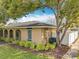 Charming home exterior with a well-maintained yard, showcasing lush plantings and a private fence at 542 Cascade Cir # 102, Casselberry, FL 32707