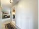Bright hallway with tiled floors, providing access to the living room and kitchen, showcasing a seamless layout at 542 Cascade Cir # 102, Casselberry, FL 32707