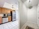 Galley kitchen features stainless steel appliances, granite countertops, and ample cabinet space at 542 Cascade Cir # 102, Casselberry, FL 32707