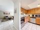 Open layout showcases a seamless transition from living area to the well-equipped kitchen with natural lighting at 542 Cascade Cir # 102, Casselberry, FL 32707