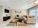 Comfortable living room with a ceiling fan, neutral colors, and sliding glass doors to the outside at 542 Cascade Cir # 102, Casselberry, FL 32707