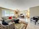 Cozy living room and dining area with a large window and view to the outside at 542 Cascade Cir # 102, Casselberry, FL 32707