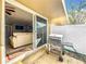 Cozy patio showcasing a grill, slider doors opening into the living room, and a white fence at 542 Cascade Cir # 102, Casselberry, FL 32707