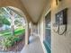 Inviting portico with arched openings leads to the front door, offering a glimpse of the home's charm at 542 Cascade Cir # 102, Casselberry, FL 32707