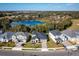 Community overview showcasing homes near a pond at 686 Creeping Fig St, Apopka, FL 32703