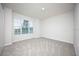 Charming bedroom with gray carpet and a window with blinds at 686 Creeping Fig St, Apopka, FL 32703