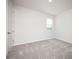 Well-lit bedroom featuring gray carpeting and a closet at 686 Creeping Fig St, Apopka, FL 32703
