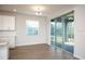 Bright dining area with sliding glass doors to backyard at 686 Creeping Fig St, Apopka, FL 32703