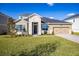 Two-story house with stone accents and a 2-car garage at 686 Creeping Fig St, Apopka, FL 32703