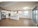 Modern kitchen with white cabinets, island, and breakfast nook at 686 Creeping Fig St, Apopka, FL 32703