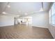 Spacious living room with hardwood floors and kitchen view at 686 Creeping Fig St, Apopka, FL 32703