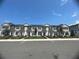 New townhomes with gray and white exterior, red doors at 686 Creeping Fig St, Apopka, FL 32703