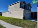 Well-kept home showcasing a lush green lawn, an attached two-car garage, and an appealing two-story facade at 247 Villavista Ct, Davenport, FL 33896