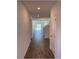 Inviting entryway featuring tile flooring, recessed lighting, and a glimpse into the spacious living areas at 247 Villavista Ct, Davenport, FL 33896