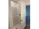 This walk-in shower features a shower head and neutral tile at 247 Villavista Ct, Davenport, FL 33896