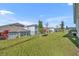 Spacious backyard features a well manicured lawn and privacy fence at 4473 Davos Dr, Clermont, FL 34711