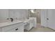 Modern bathroom with double vanity, quartz countertops, and glass-enclosed shower at 4473 Davos Dr, Clermont, FL 34711