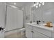 Clean bathroom features a white shower, vanity and tile flooring at 4473 Davos Dr, Clermont, FL 34711