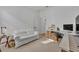 Bright bedroom features a desk area, sofa, neutral carpet, and natural light at 4473 Davos Dr, Clermont, FL 34711
