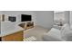 Bright bedroom features a desk area, sofa, neutral carpet, and natural light at 4473 Davos Dr, Clermont, FL 34711