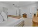 Comfortable bedroom with neutral walls, soft carpet, and multiple doors and windows at 4473 Davos Dr, Clermont, FL 34711