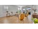 Bright living room with hardwood floors, neutral colors, and sliding glass doors to the patio at 4473 Davos Dr, Clermont, FL 34711