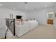Bright living room features a large sectional sofa and a television at 4473 Davos Dr, Clermont, FL 34711
