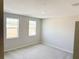 Neutral bedroom with carpet, two windows and ample natural light at 576 Pothos St, Apopka, FL 32703