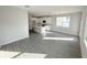 Bright, open-concept living space featuring modern lighting, tile floors and a kitchen with a center island at 576 Pothos St, Apopka, FL 32703