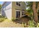 Backyard featuring a patio and mature trees, offering a great space for outdoor entertaining at 9517 Brackin St, Orlando, FL 32825