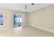 Well lit dining area with sliding doors to the backyard and ample empty space at 9517 Brackin St, Orlando, FL 32825